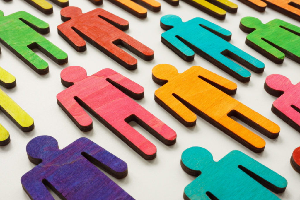 Diversity concept. Colorful figures of people on the surface.